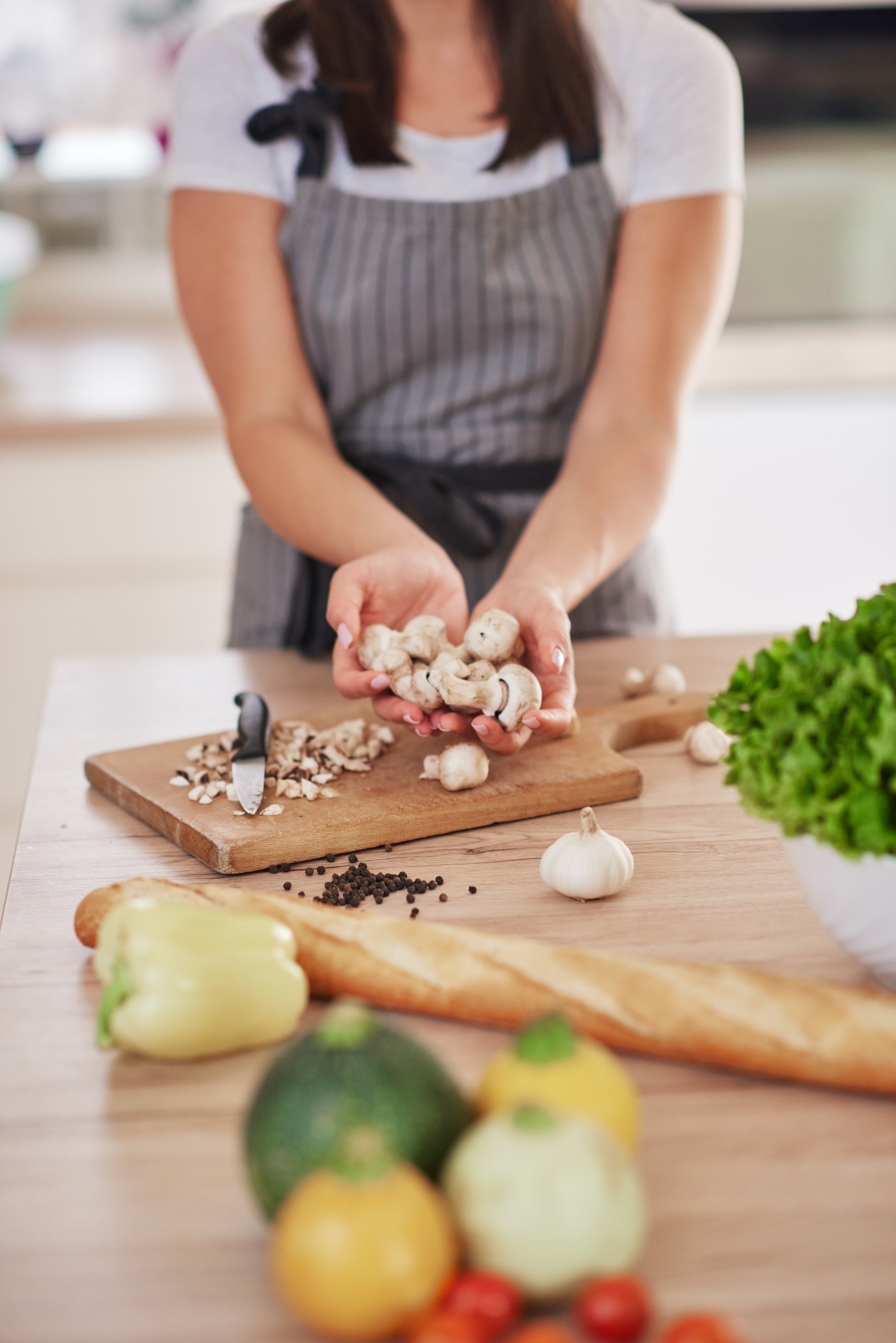 Woman cooking dinner.